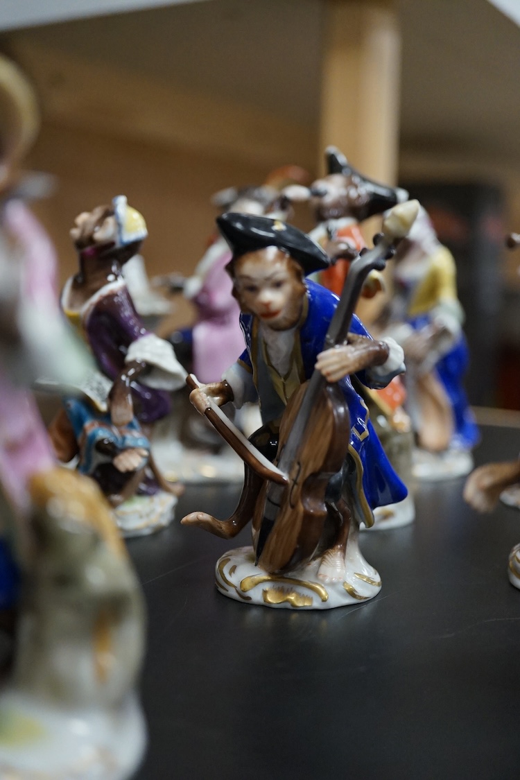 A group of twenty German porcelain monkey band figures, largest 15.5cm high